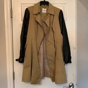 Trench jacket with faux leather sleeves and gold hardware. Brand is Bebe - sz M
